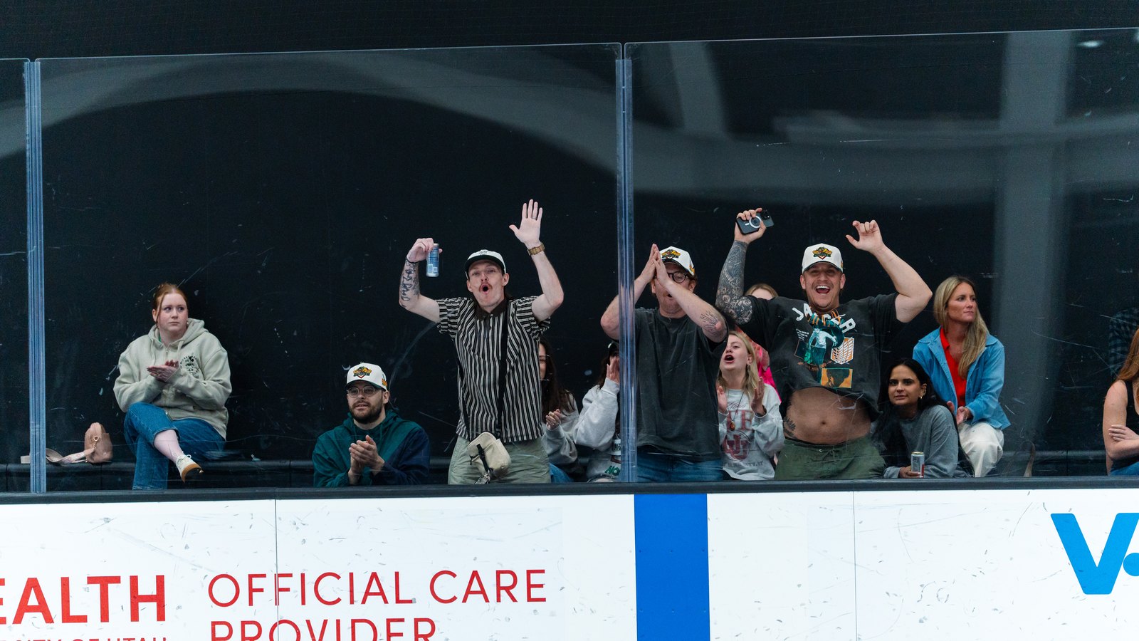 Utah Glizzies fans cheering at the glass